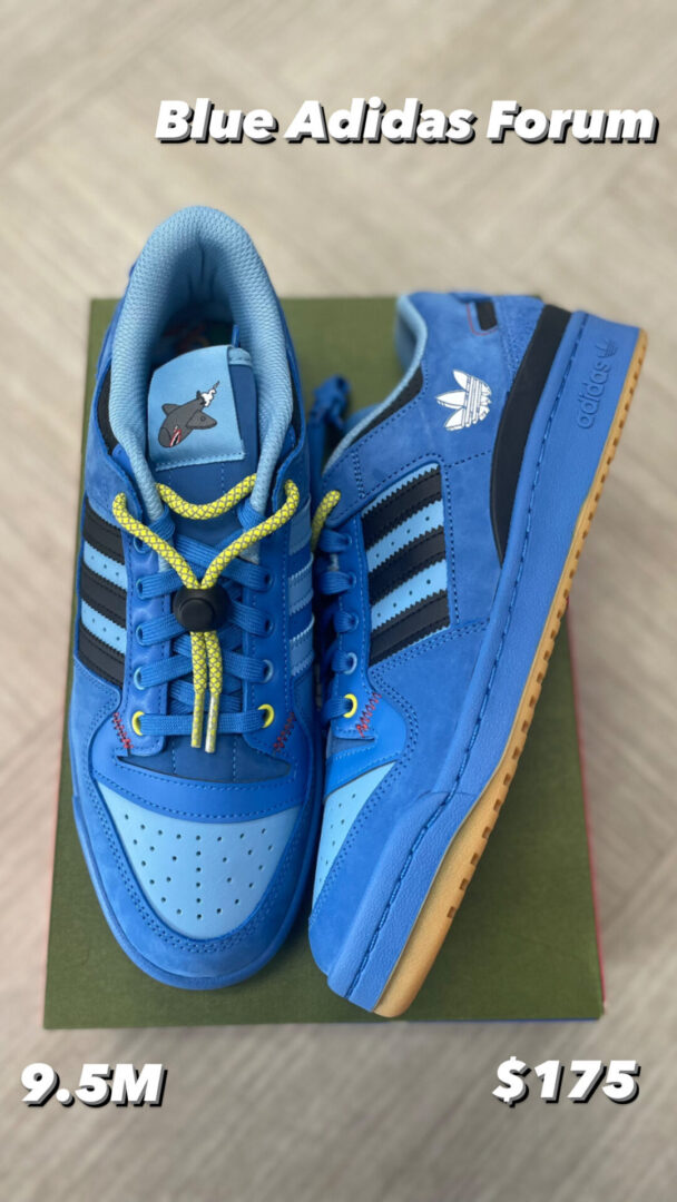 A pair of Blue Adidas Forum sneakers, size 9.5m, priced at $175, displayed on a green surface with contrasting yellow laces.