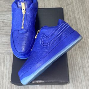 A pair of blue Af1 LXX sneakers on a box, displayed on a wooden floor with size and price label visible.