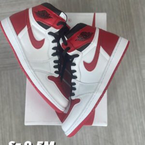 A pair of Heritage Jordan 1 sneakers displayed on their box, featuring red and white colors, available in sizes 9.5m, 10m, and 10.5m, priced at $220 each.