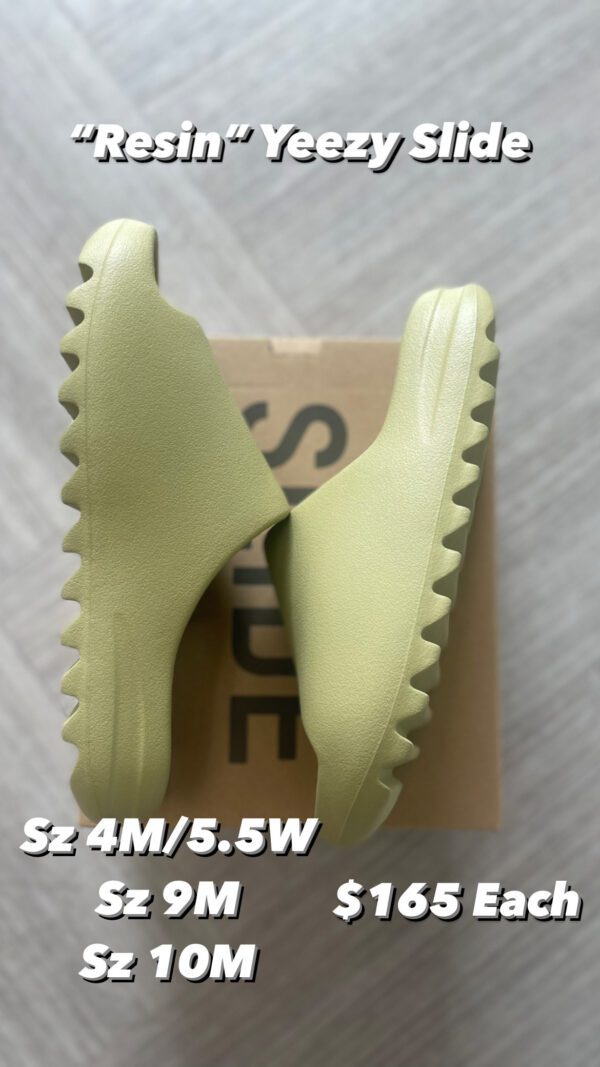 A pair of pale green Resin Yeezy Slides displayed on top of their shoebox, labeled with sizes and prices.