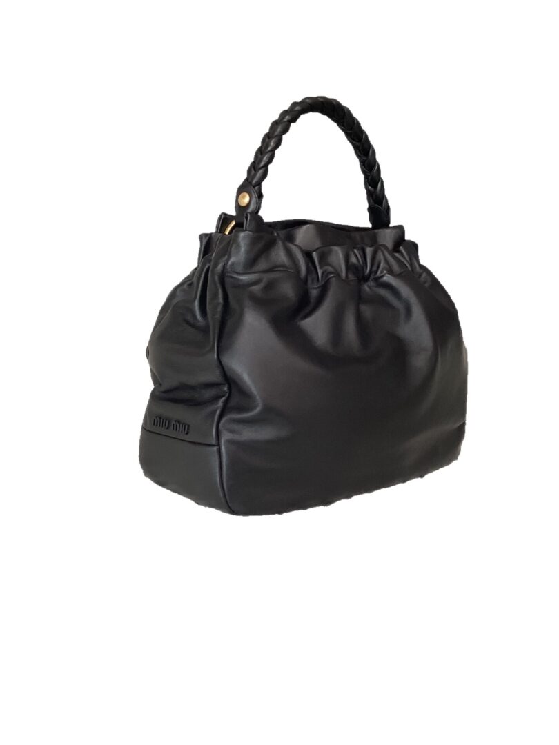Miu Miu Hobo Bag with a braided handle and cinched design, isolated on a white background.