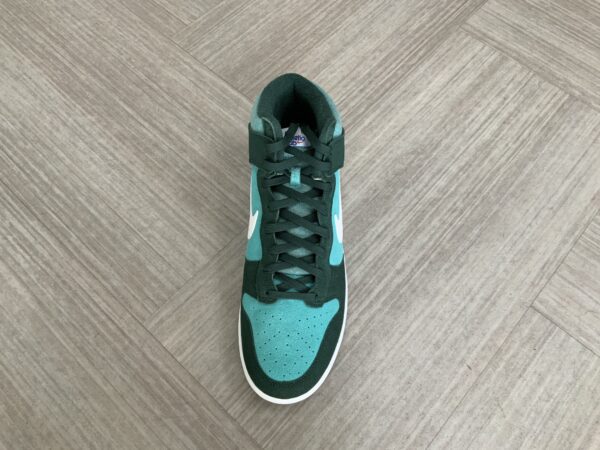 A single High top Dunk SE (Athletic Club - Pro Green) sneaker on a wooden floor, viewed from above.