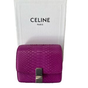 A vibrant purple Celine Python Crossbody Bag displayed in front of its white branded bag with "celine paris" printed on it.